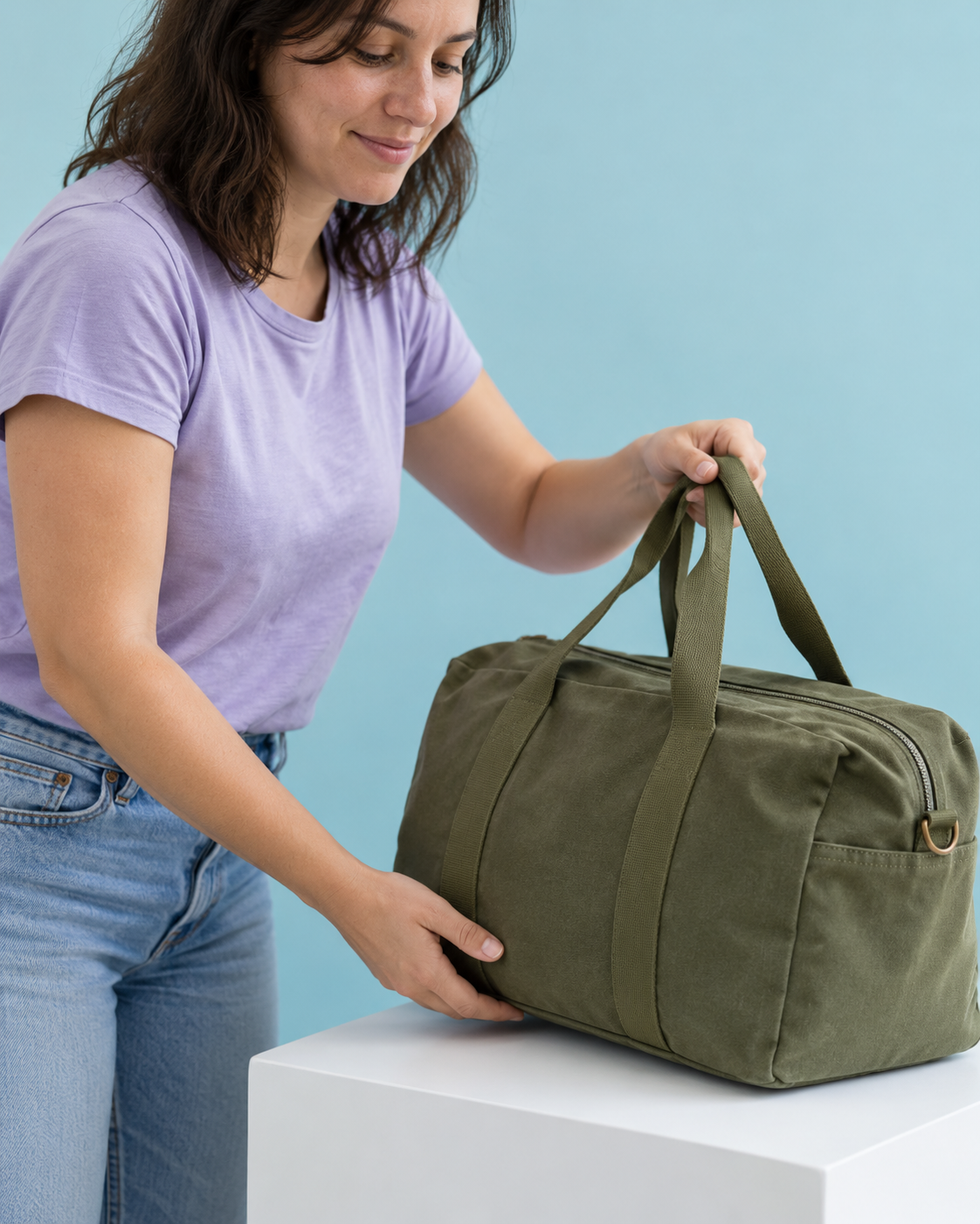 A customer choosing a green weekender from a white display